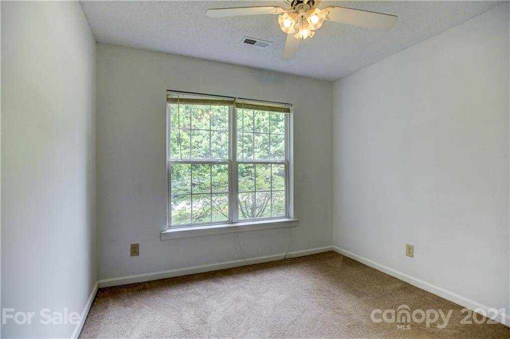 239 Valleyview Road Mooresville, NC 28117 - Photo 30 of 41 a view of an empty room with a window