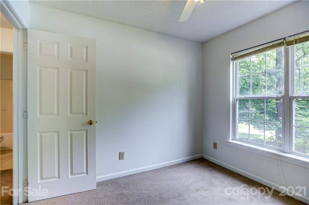 239 Valleyview Road Mooresville, NC 28117 - Photo 31 of 41 an empty room with windows and closet