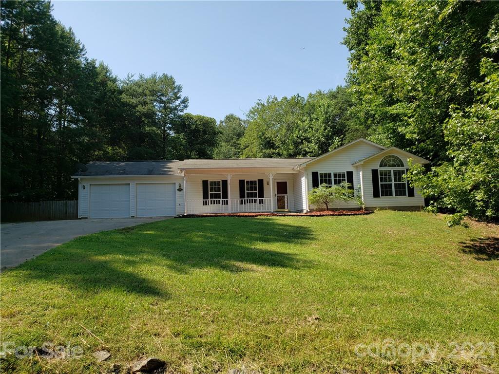 239 Valleyview Road Mooresville, NC 28117 - Photo 41 of 41 a front view of a house with yard and green space