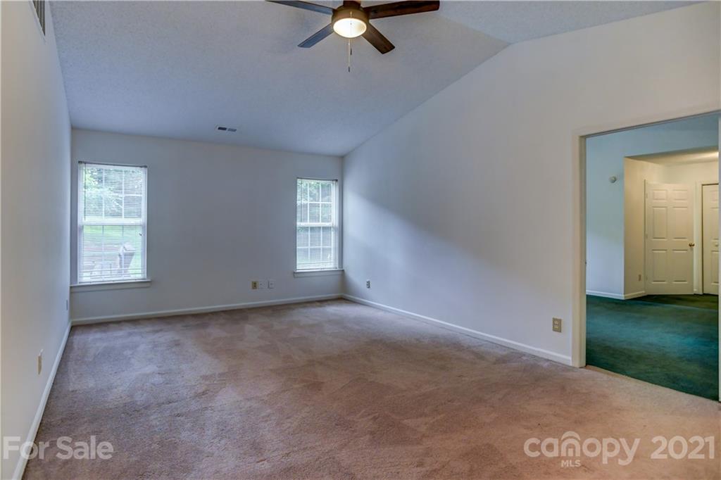 239 Valleyview Road Mooresville, NC 28117 - Photo 6 of 41 a view of a livingroom with a ceiling fan and window