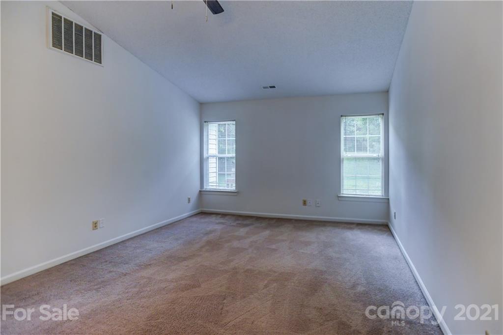 239 Valleyview Road Mooresville, NC 28117 - Photo 7 of 41 a view of an empty room with a window
