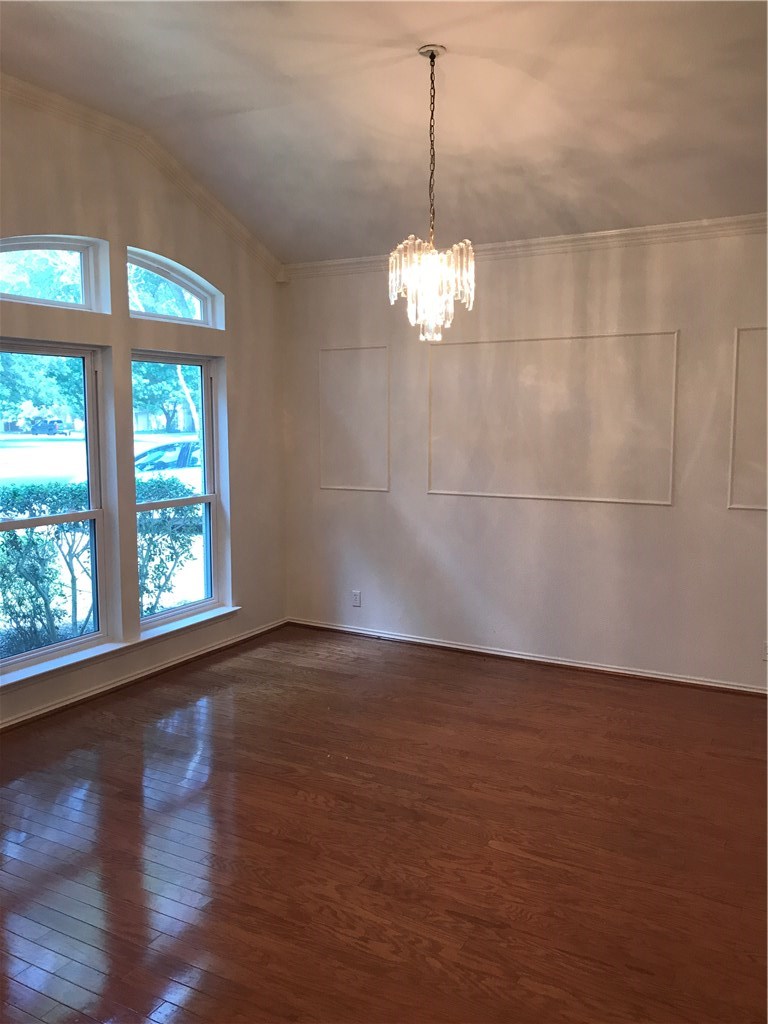 6428 Ruxton Lane Austin, TX 78749 - Photo 2 of 23 a view of a livingroom with a chandelier wooden floor and a window