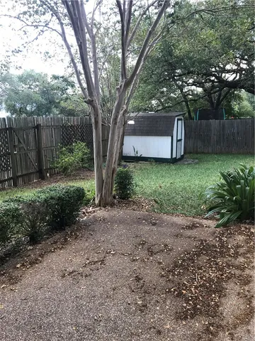 a backyard of a house with lots of green space