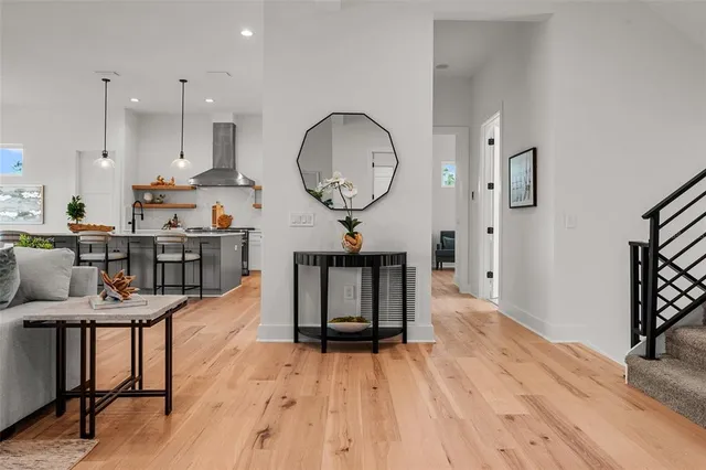 a kitchen with kitchen island a white counter top space and cabinets