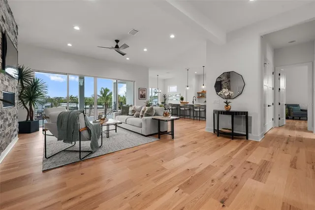 a large kitchen with stainless steel appliances kitchen island granite countertop a large island in the center