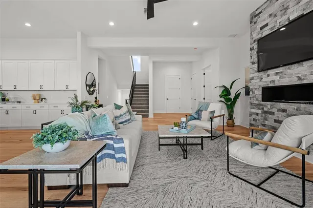 a kitchen with stainless steel appliances a stove and wooden floor