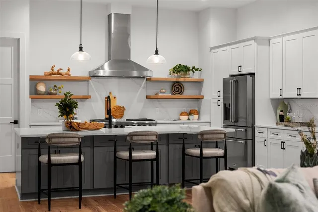 a view of a livingroom with furniture and hardwood floor