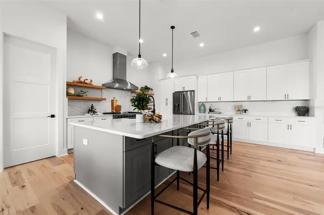 a bedroom with a bed and a table