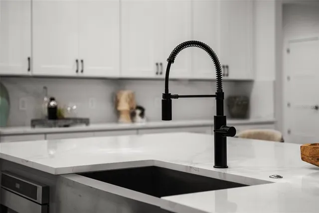 a bedroom with a large bed and a large window