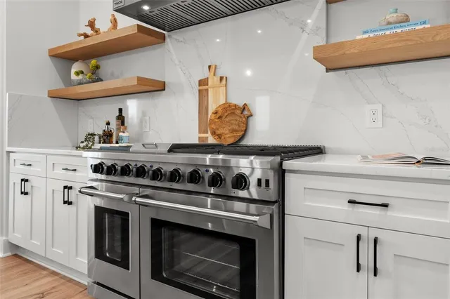 a white bath tub sitting next to a white sink