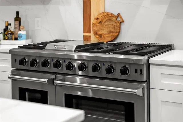 a bathroom with a sink a toilet and a shower