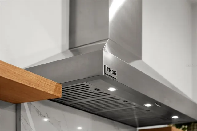 a bathroom with a double vanity sink a mirror and a bathtub