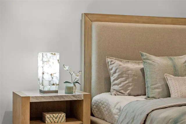 a view of a patio with dining table and chairs