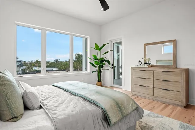 a view of a balcony with dining table and chairs with wooden floor
