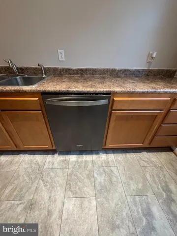 a kitchen with a refrigerator stove and microwave