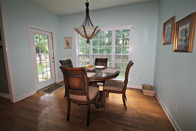 87 Oak Hollow Road Manchester, TN 37355 - Photo 8 of 18 Breakfast nook with windows that face wooded lot in the rear. Stunning light fixture.