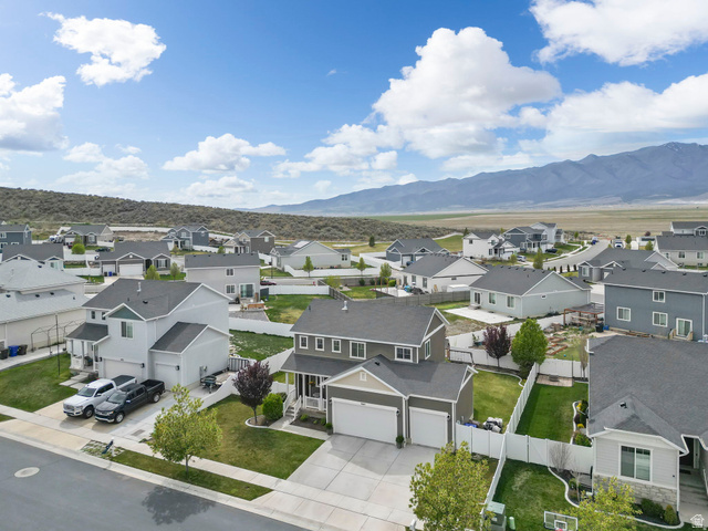 7685 Timber Country Road Eagle Mountain, UT 84005 - Photo 38 of 39 Aerial perspective showcasing a residential community with a mountain backdrop