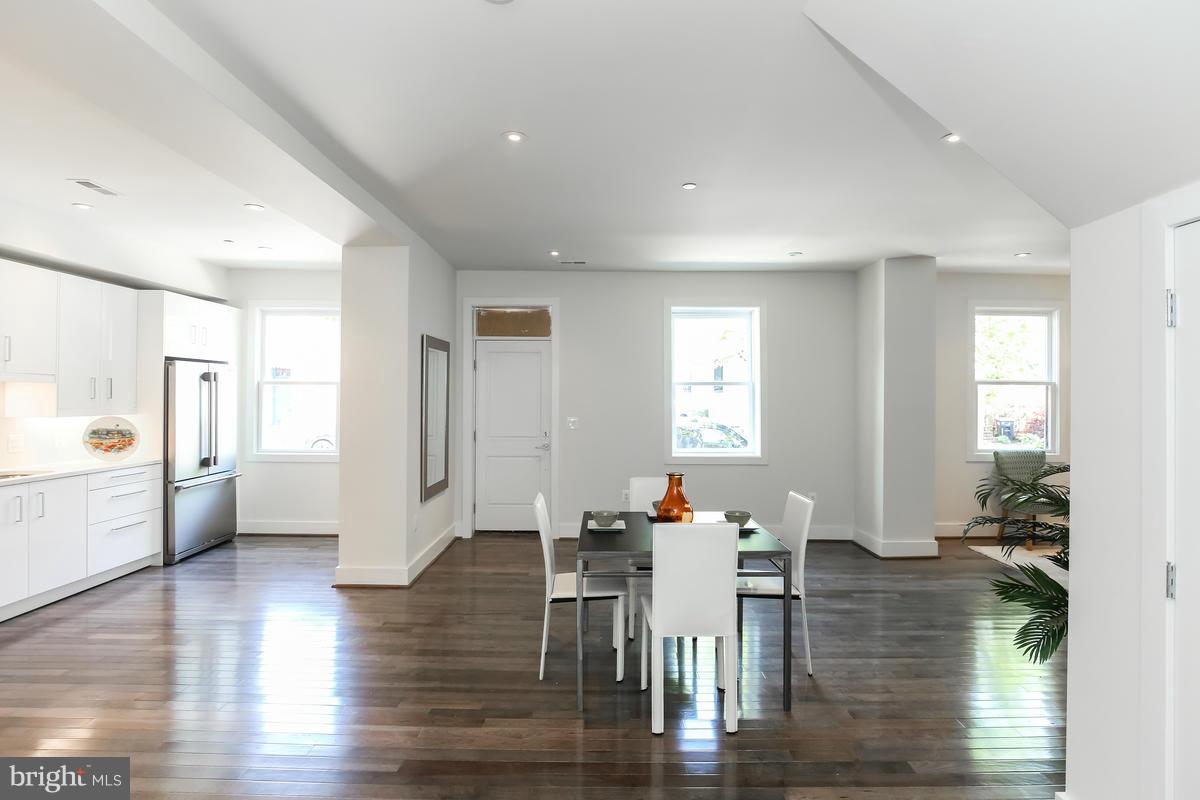 460 Ridge Street Northwest, Unit 1 Washington, DC 20001 - Photo 14 of 28 a view of a dining room with furniture and wooden floor