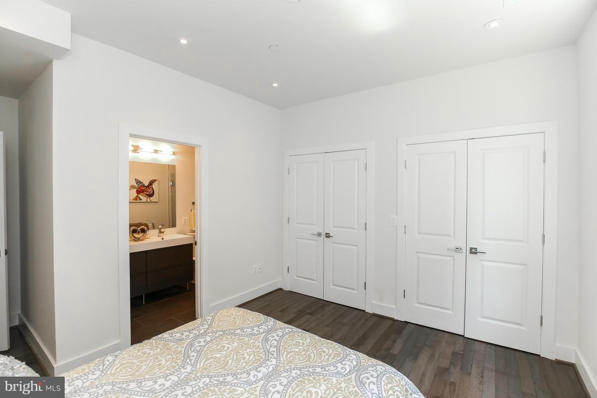 460 Ridge Street Northwest, Unit 1 Washington, DC 20001 - Photo 17 of 28 a bedroom with a bed and closet