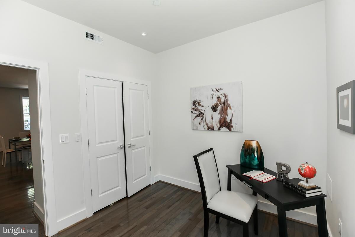 460 Ridge Street Northwest, Unit 1 Washington, DC 20001 - Photo 18 of 28 a view of a dining room with furniture and wooden floor