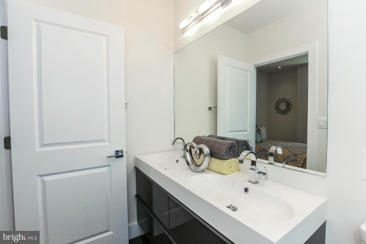 460 Ridge Street Northwest, Unit 1 Washington, DC 20001 - Photo 19 of 28 a bathroom with a sink and a mirror