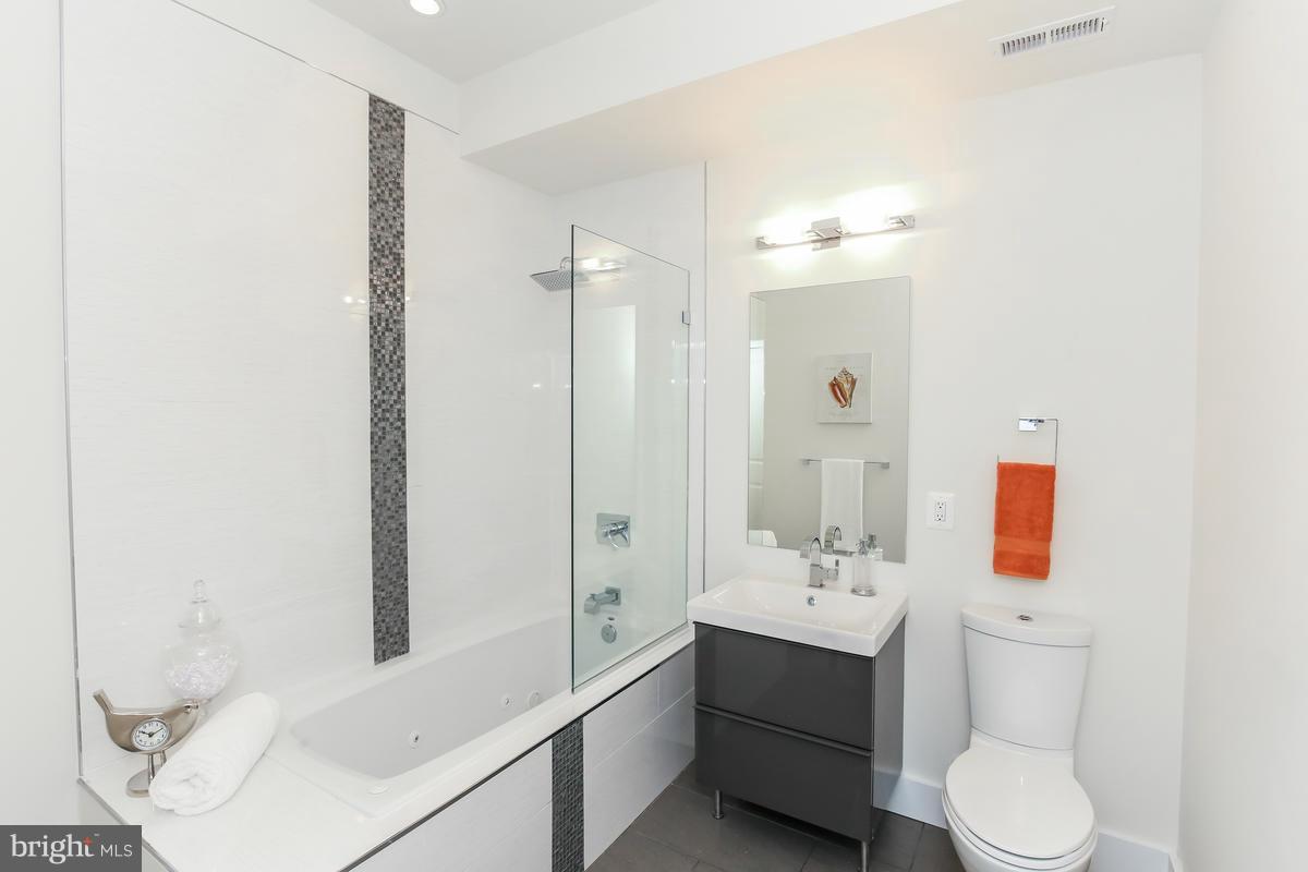 460 Ridge Street Northwest, Unit 1 Washington, DC 20001 - Photo 21 of 28 a bathroom with a sink toilet and shower