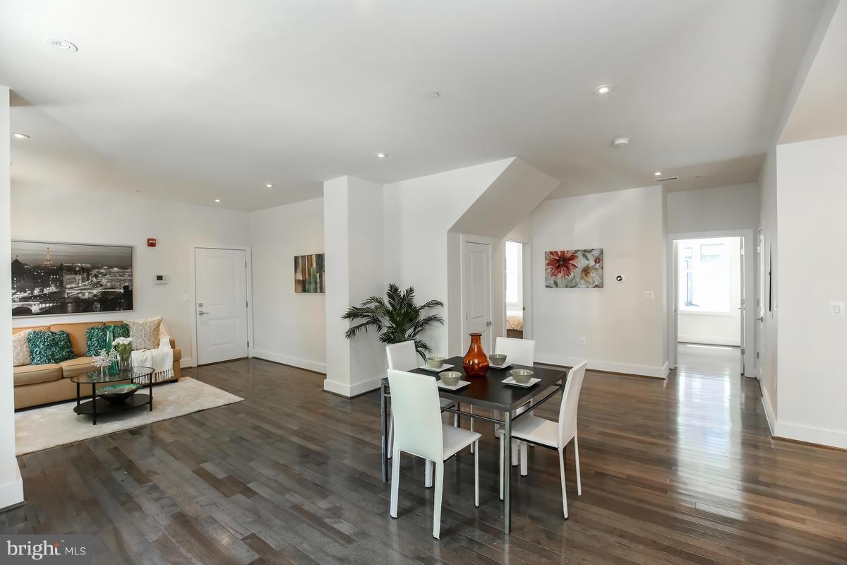 460 Ridge Street Northwest, Unit 1 Washington, DC 20001 - Photo 8 of 28 a view of a dining room with furniture and wooden floor