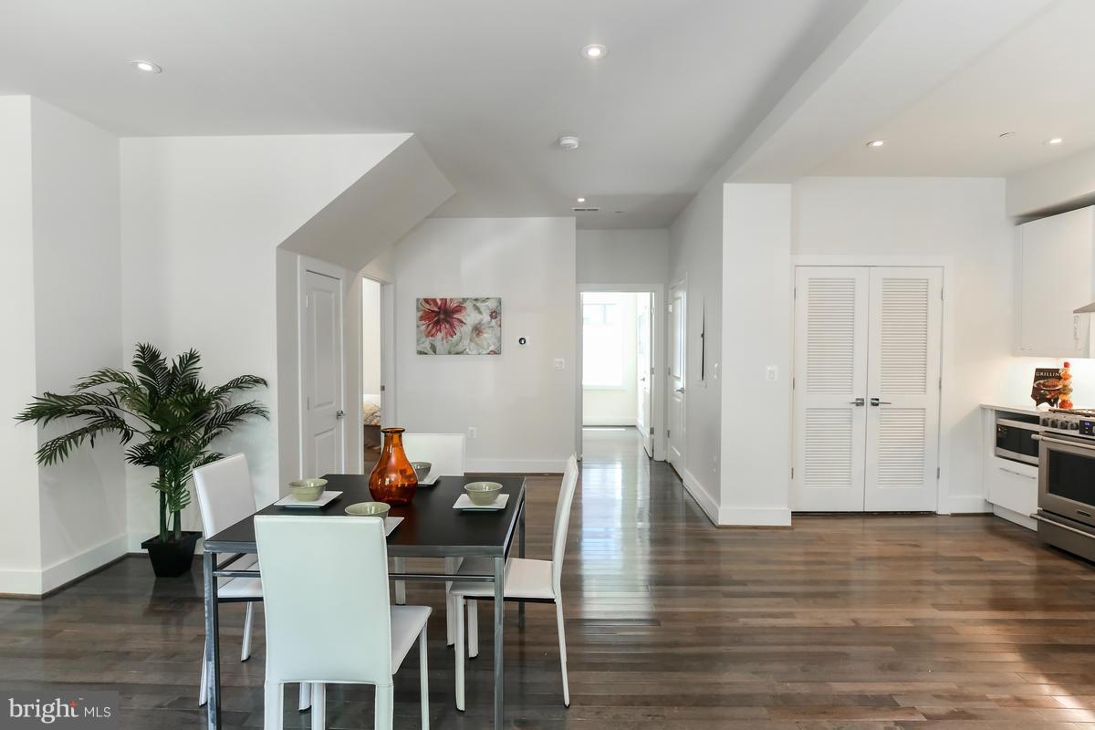 460 Ridge Street Northwest, Unit 1 Washington, DC 20001 - Photo 9 of 28 a view of a dining room with furniture and wooden floor