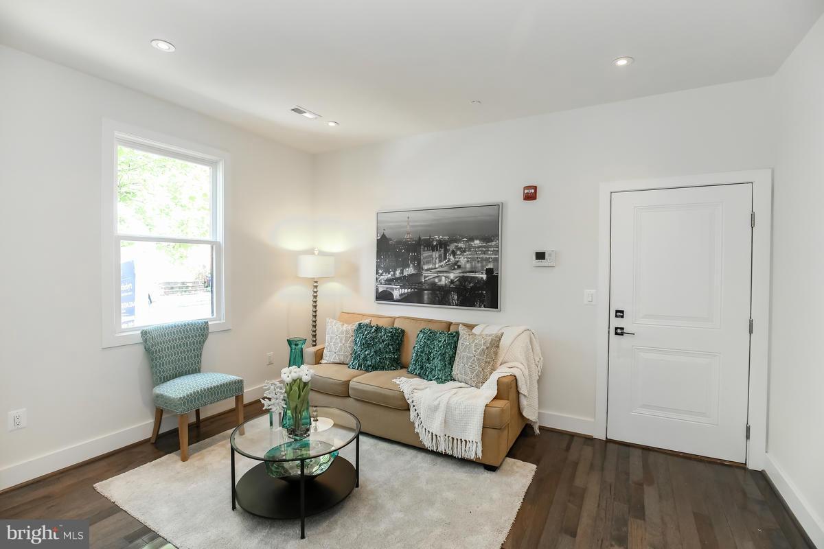 460 Ridge Street Northwest, Unit 1 Washington, DC 20001 - Photo 10 of 28 a living room with furniture and a window