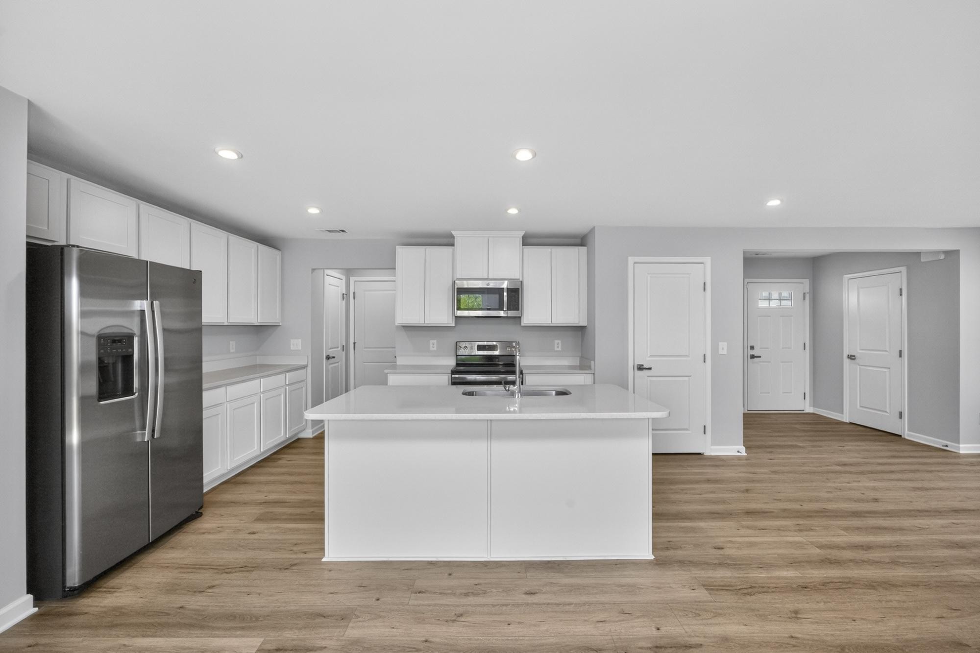 3004 Red Fox Ridge Madison, TN 37115 - Photo 16 of 45 a large kitchen with stainless steel appliances granite countertop a stove top oven a refrigerator and a sink