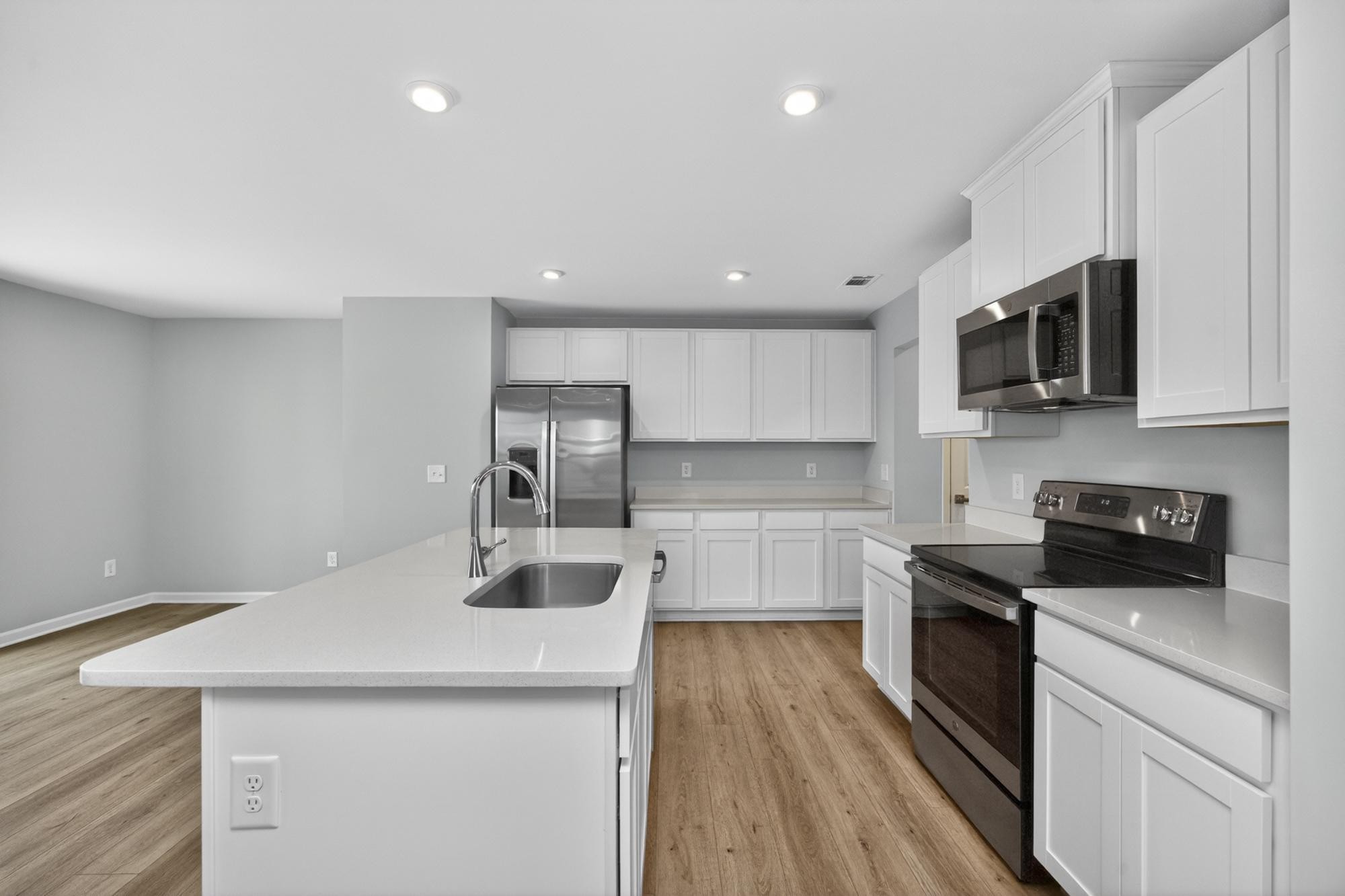 3004 Red Fox Ridge Madison, TN 37115 - Photo 17 of 45 a kitchen with stainless steel appliances a sink stove and cabinets