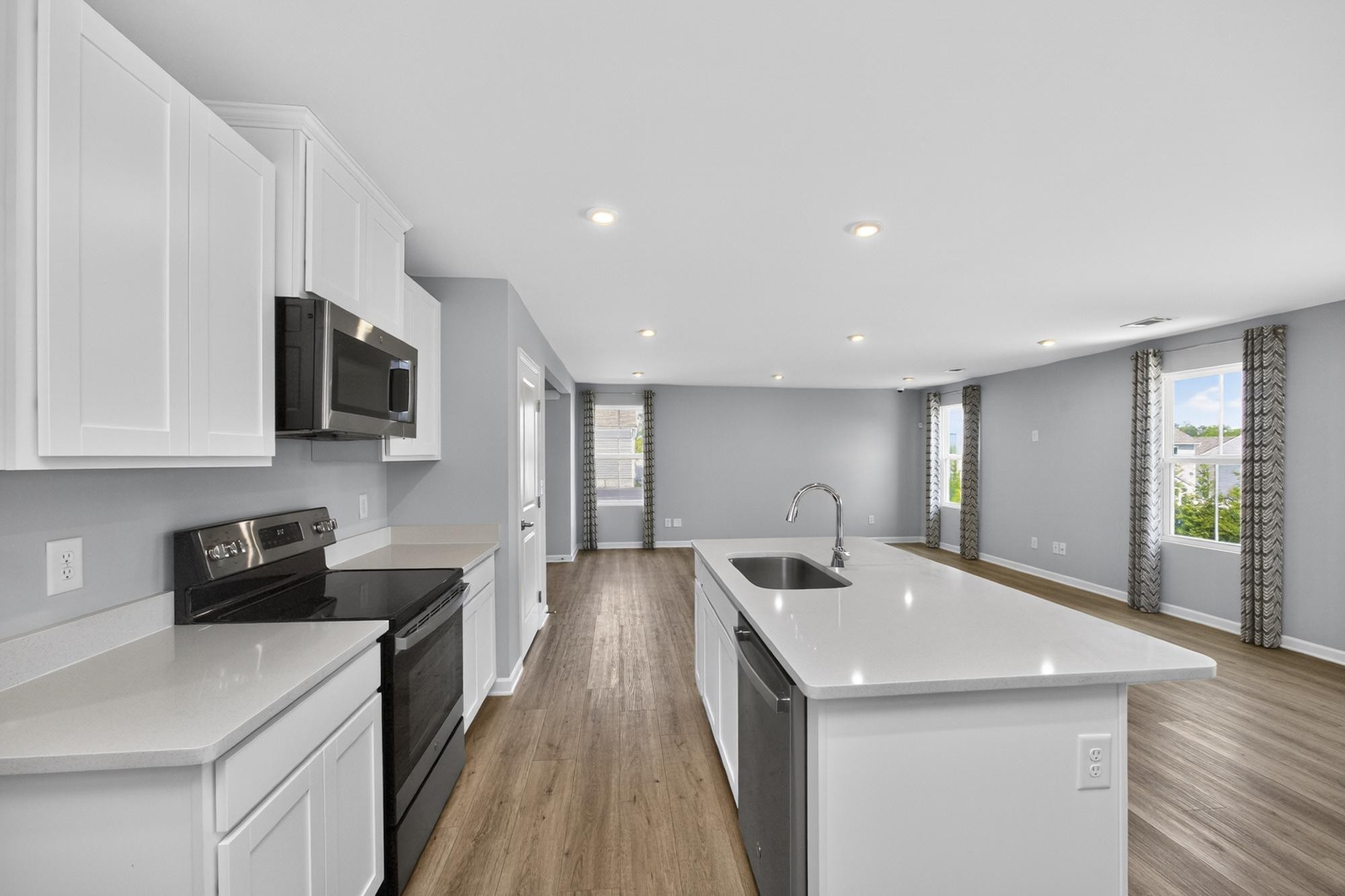 3004 Red Fox Ridge Madison, TN 37115 - Photo 19 of 45 a kitchen with stainless steel appliances a sink a stove top oven a counter space and cabinets