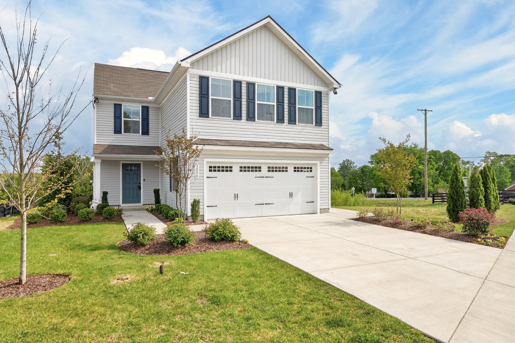 3004 Red Fox Ridge Madison, TN 37115 - Photo 3 of 45 a front view of a house with garden