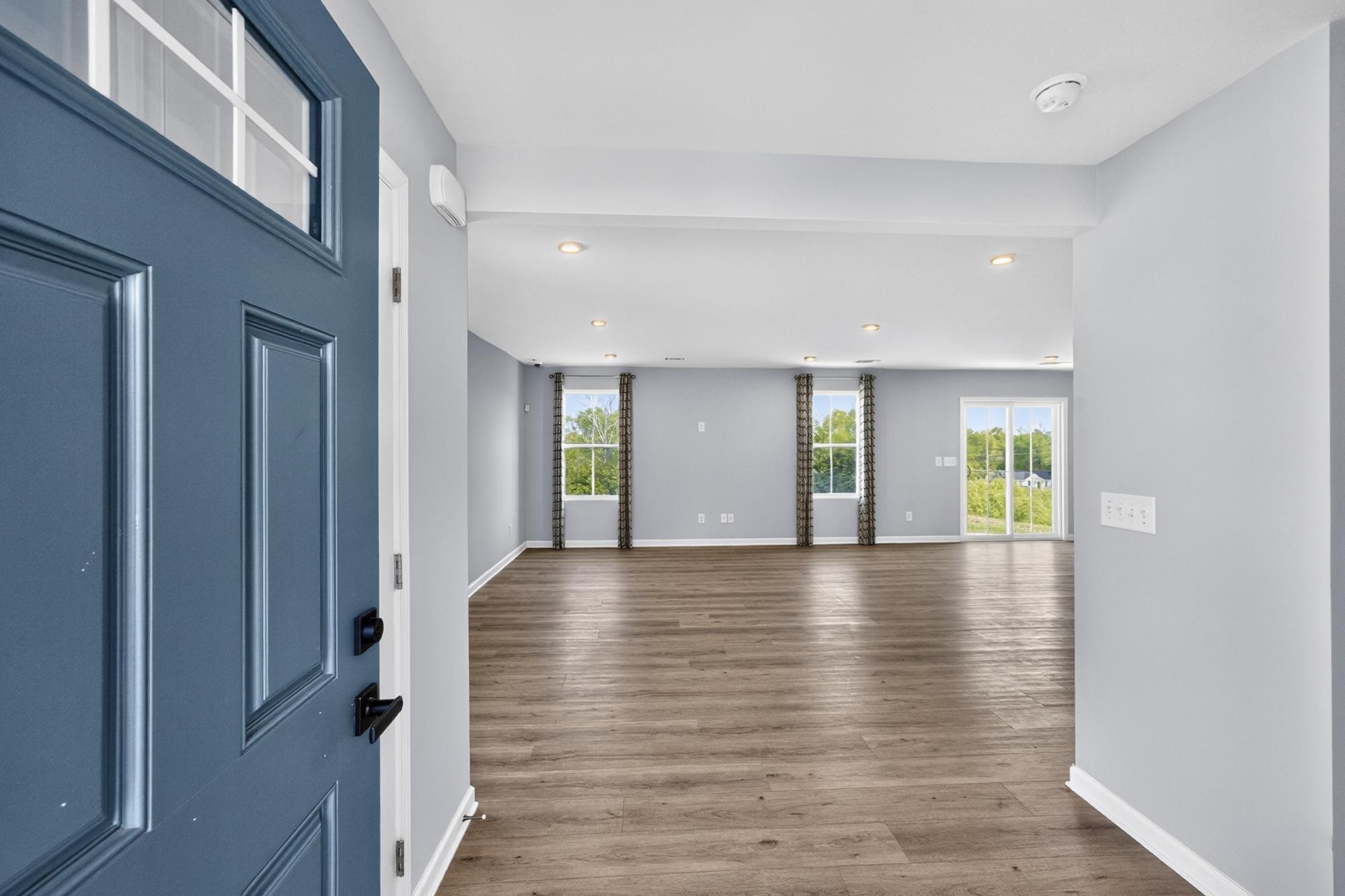 3004 Red Fox Ridge Madison, TN 37115 - Photo 5 of 45 a view of an empty room with window and wooden floor