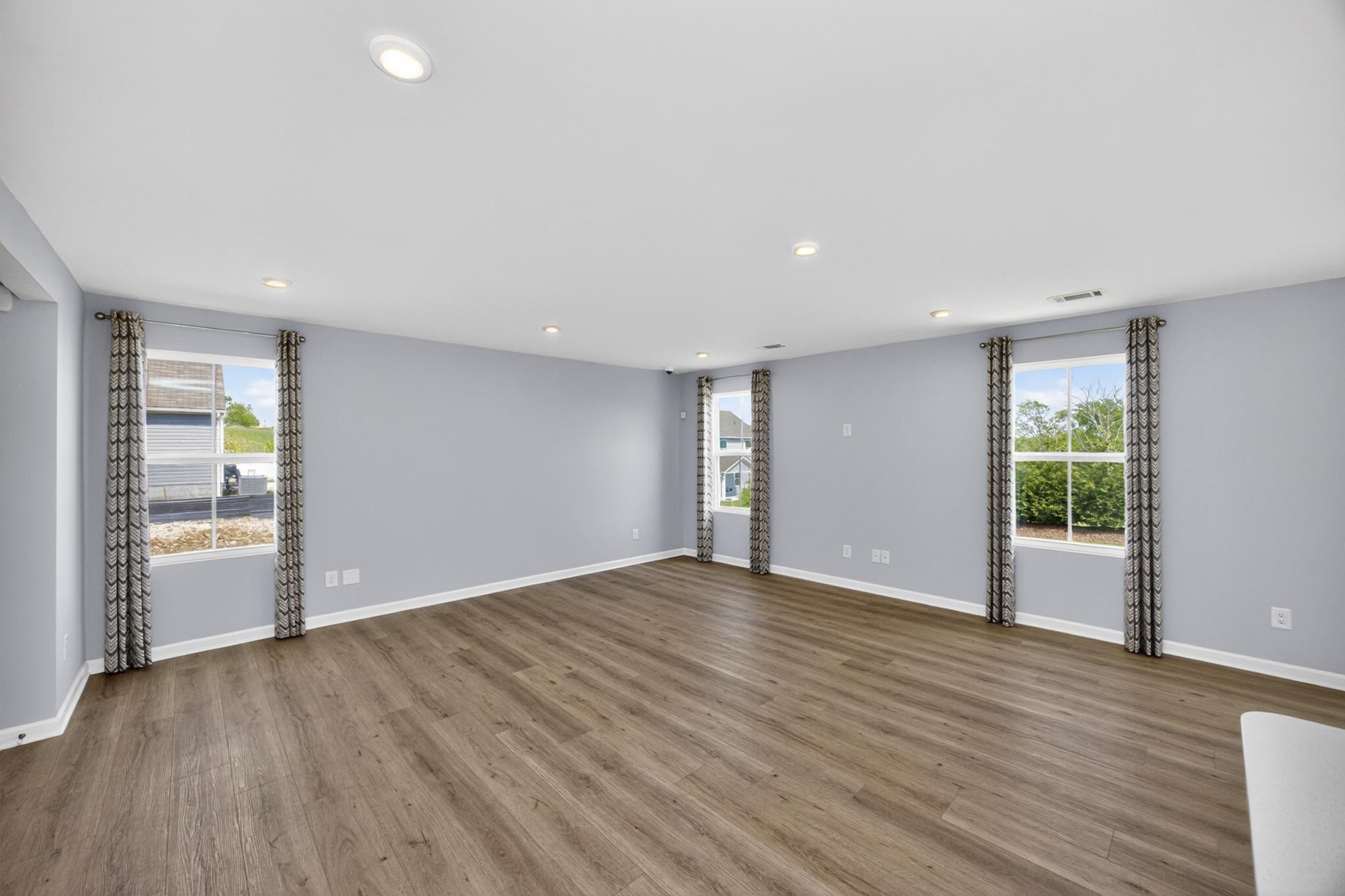 3004 Red Fox Ridge Madison, TN 37115 - Photo 6 of 45 a view of an empty room with wooden floor and a window