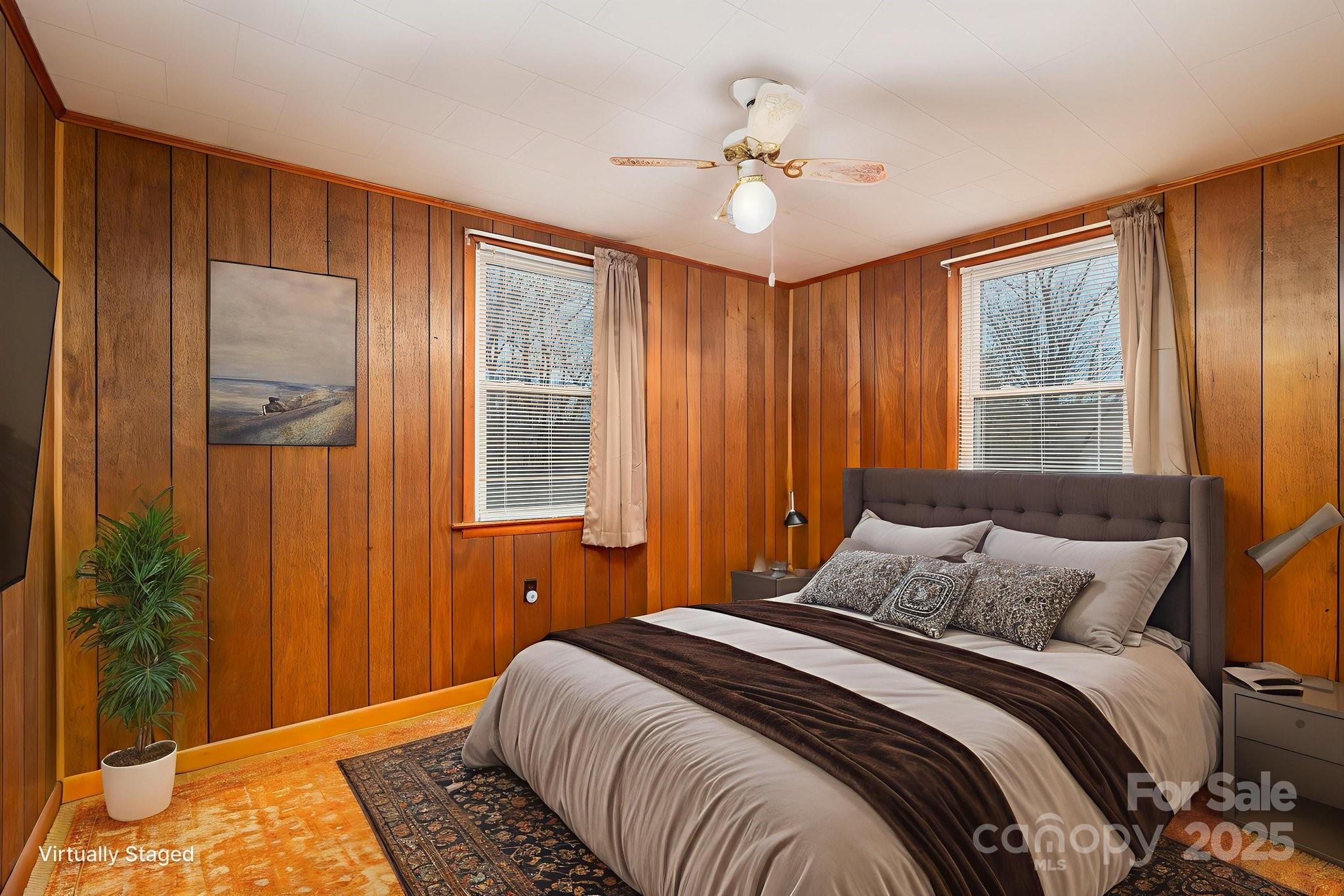 6331 Smith Road Vale, NC 28168 - Photo 14 of 33 a bedroom with a large bed and a chandelier