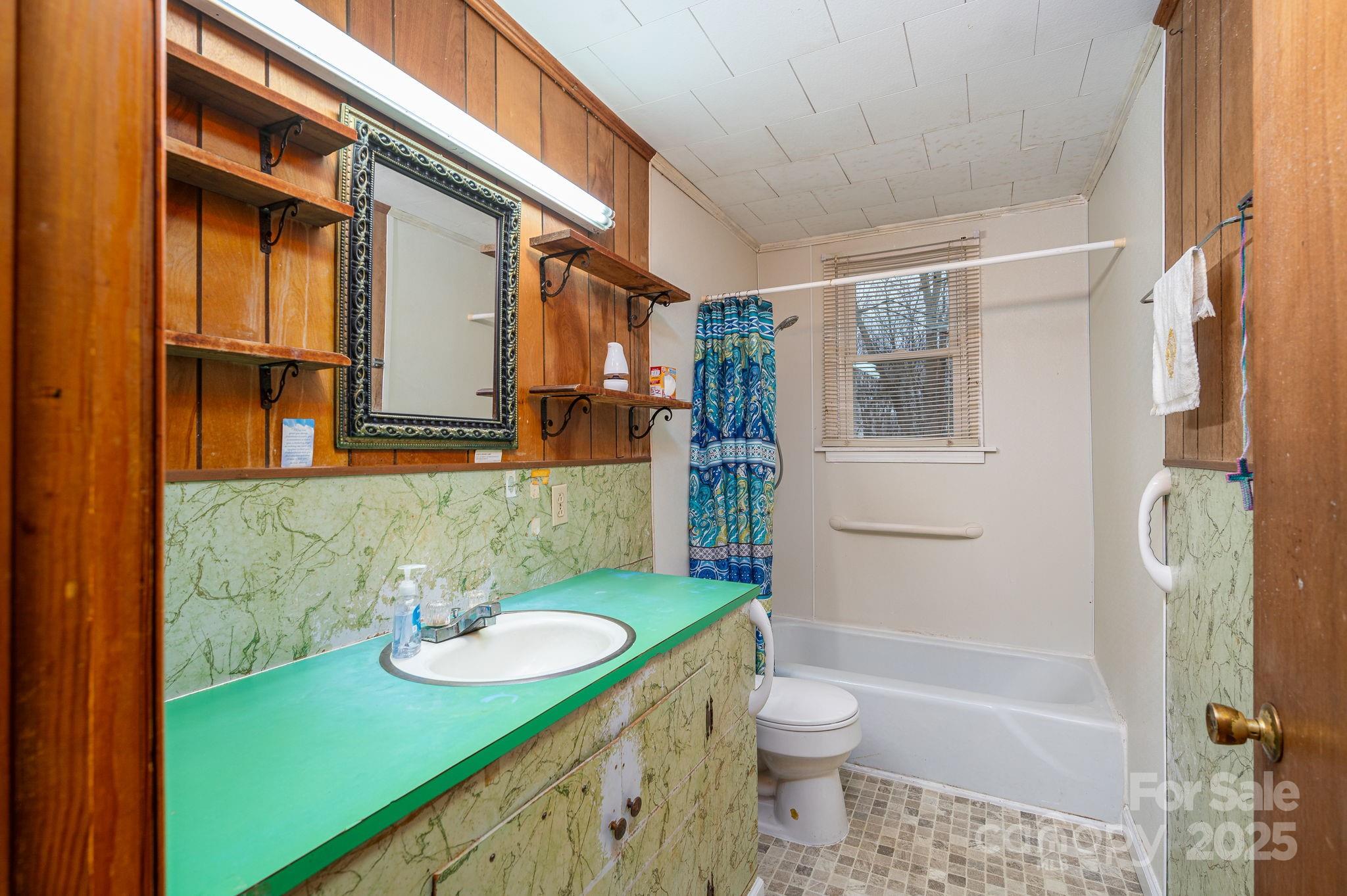 6331 Smith Road Vale, NC 28168 - Photo 22 of 33 a bathroom with a sink a toilet and shower