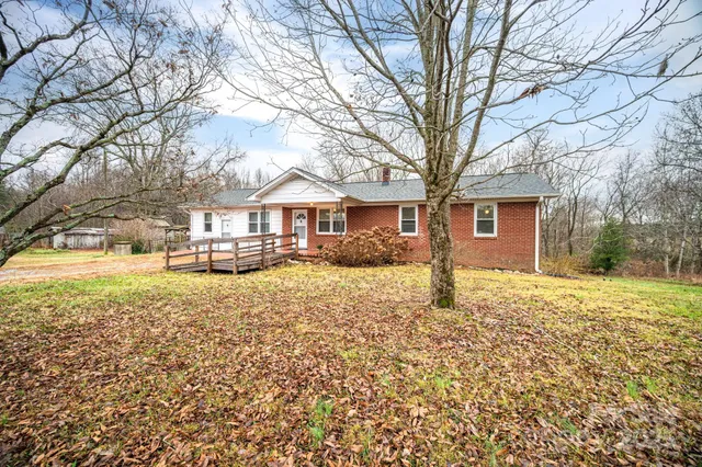 front view of a house with a bench