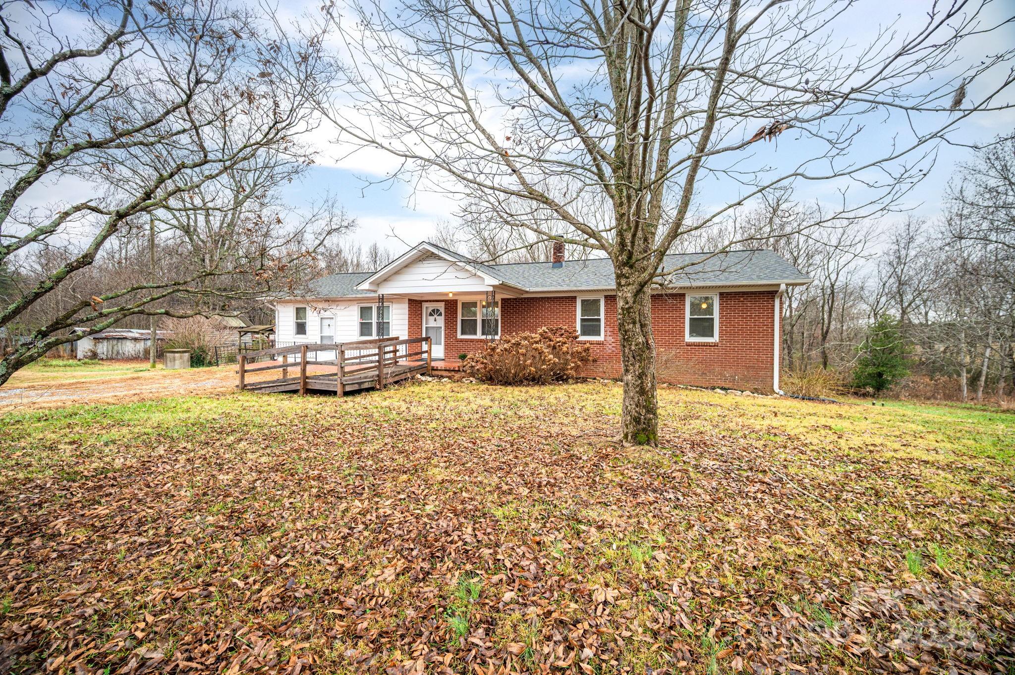 6331 Smith Road Vale, NC 28168 - Photo 5 of 33 a house with trees in front of it