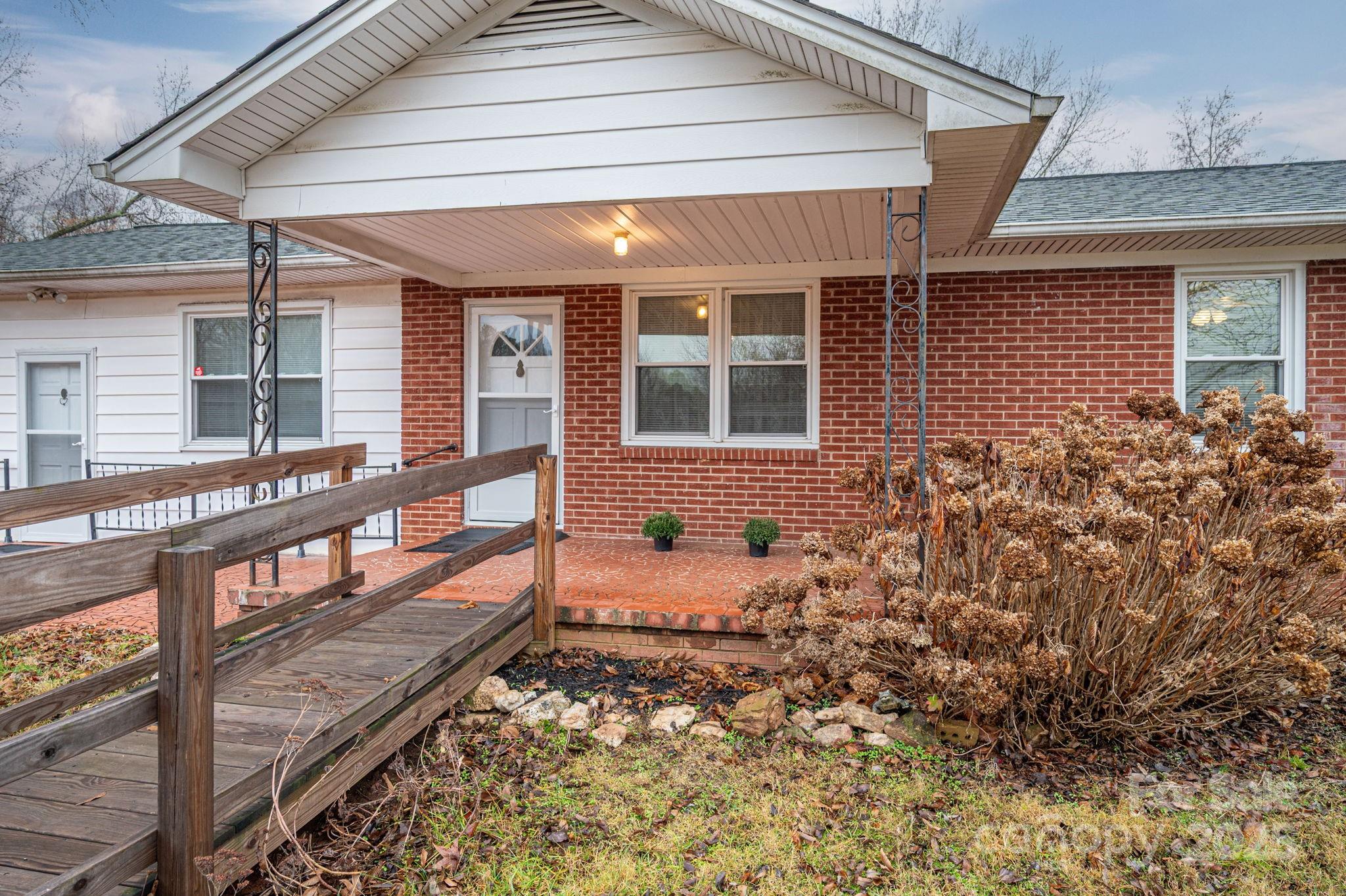 6331 Smith Road Vale, NC 28168 - Photo 7 of 33 front view of a house with a bench
