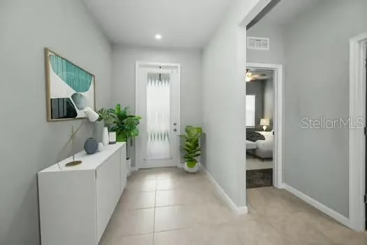 a room with a potted plant and a sink