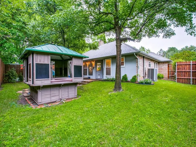 a view of a house with a yard porch and sitting area