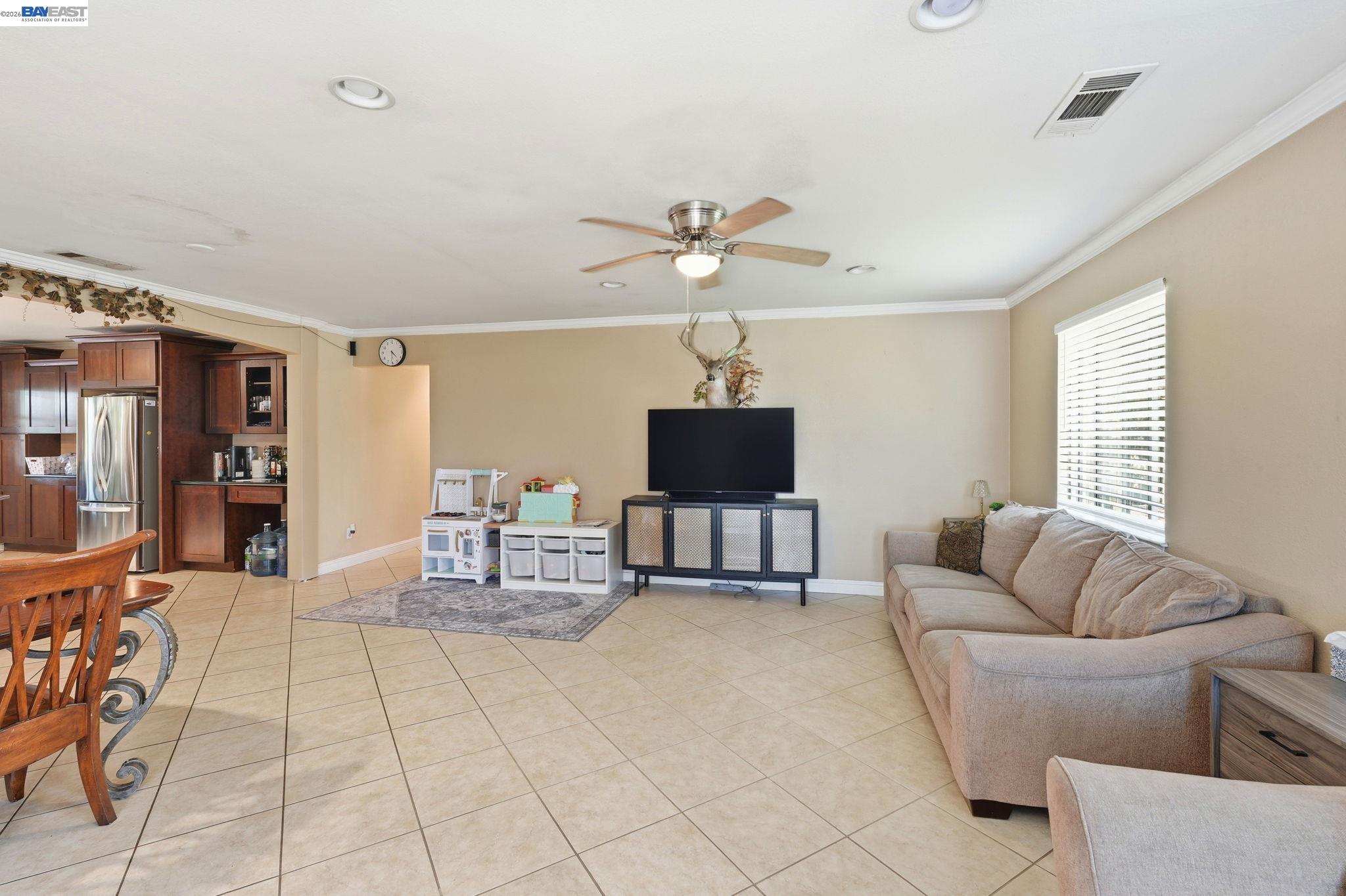 10378 South Priest Road French Camp, CA 95231 - Photo 5 of 44 a living room with furniture and a flat screen tv