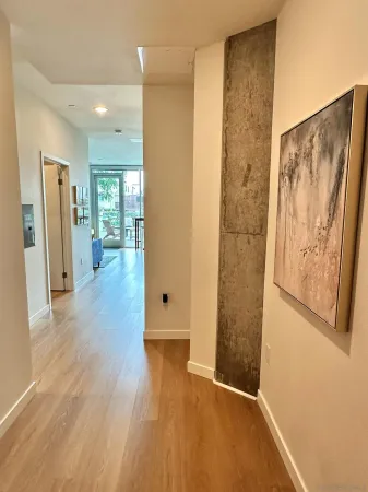 a view of a white house next to a yard