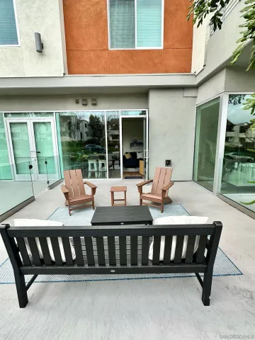 a view of a chairs and table in the patio
