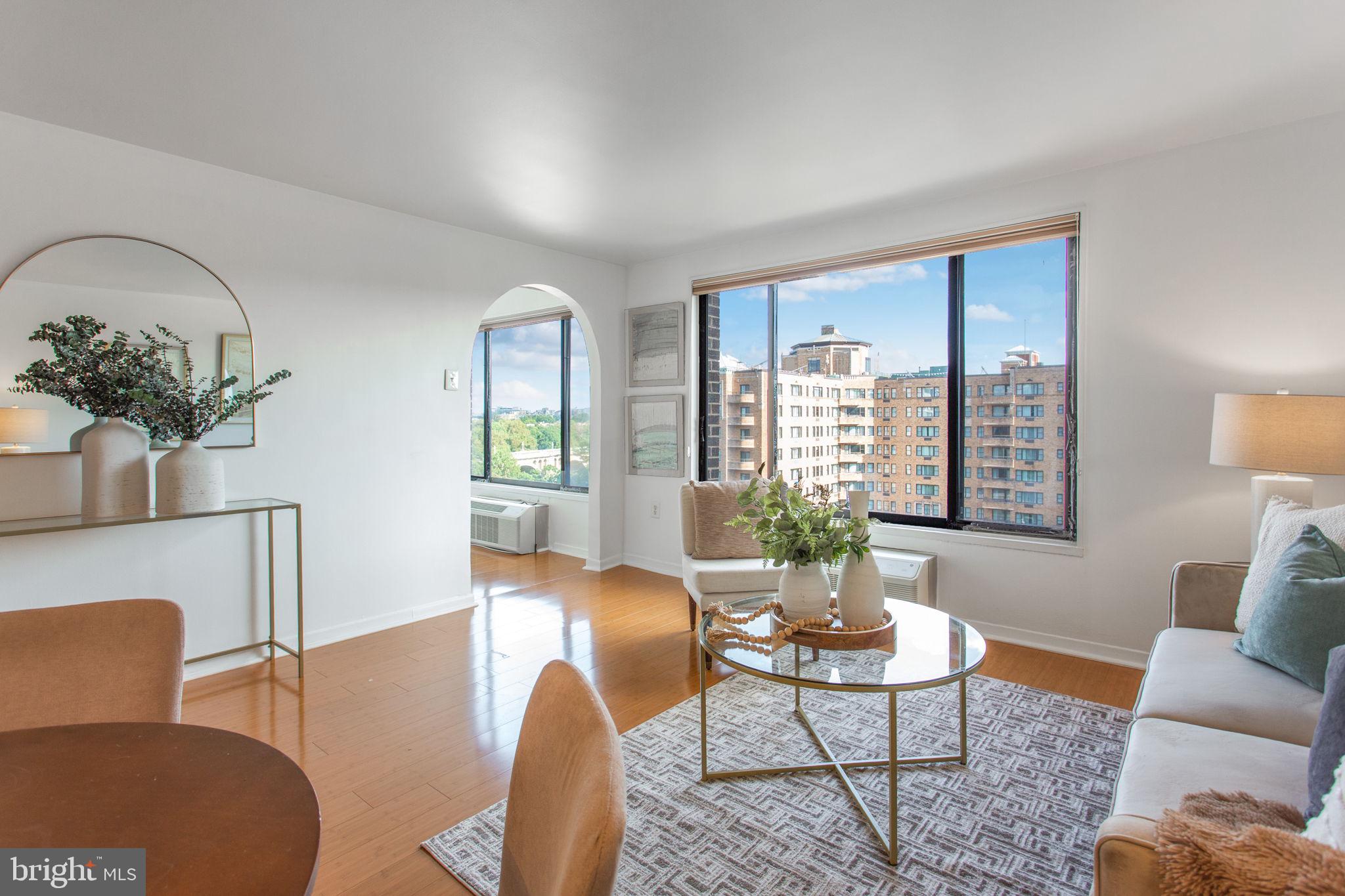 2501 Calvert Street Northwest, Unit 802 Washington, DC 20008 - Photo 11 of 20 a living room with furniture and a large window