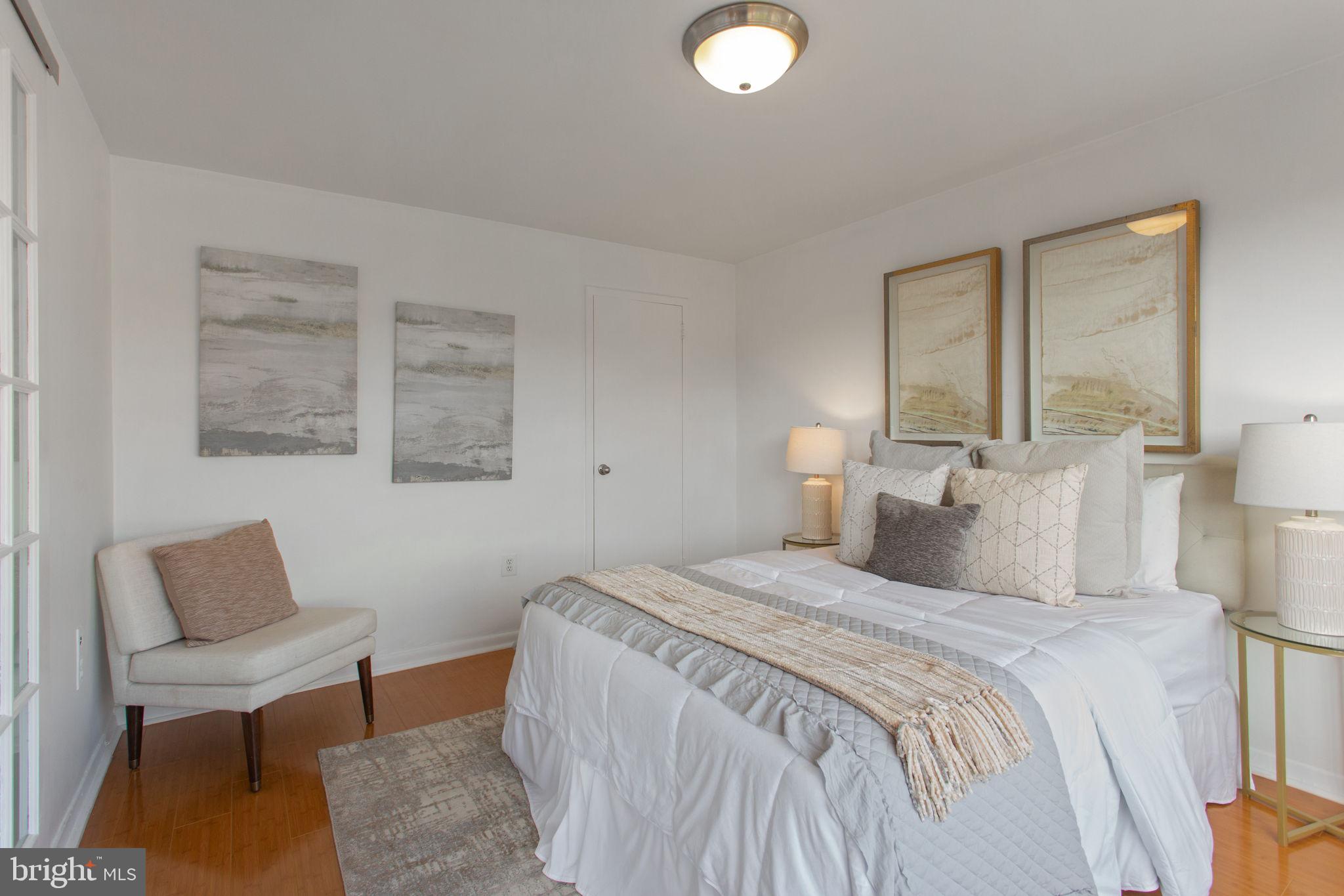 2501 Calvert Street Northwest, Unit 802 Washington, DC 20008 - Photo 15 of 20 a bedroom with a bed and a couch