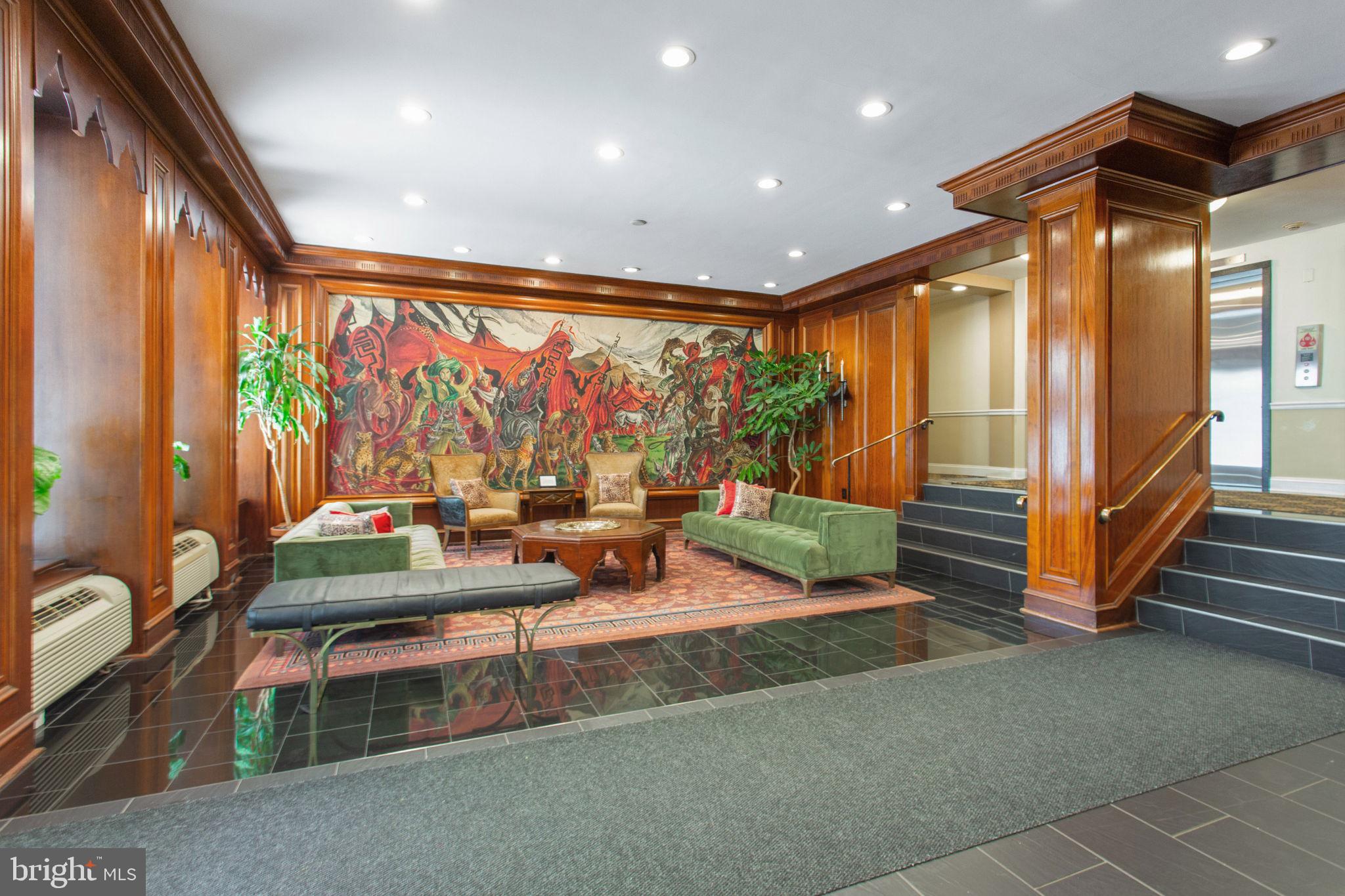 2501 Calvert Street Northwest, Unit 802 Washington, DC 20008 - Photo 3 of 20 a room with lots of furniture and a potted plant