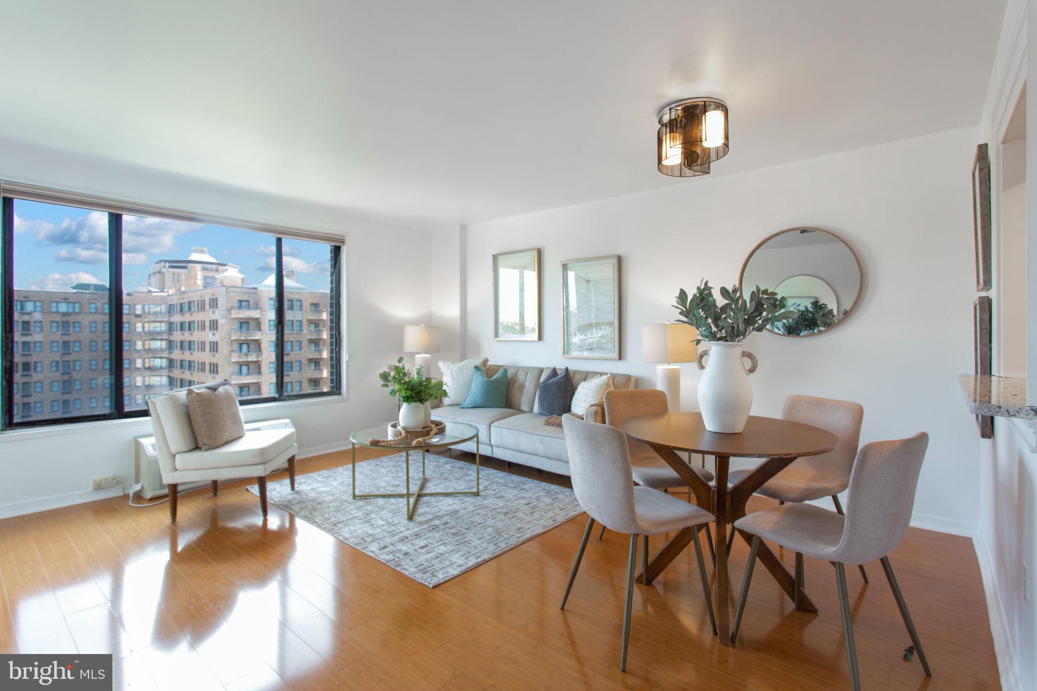 2501 Calvert Street Northwest, Unit 802 Washington, DC 20008 - Photo 6 of 20 a living room with furniture and a large window