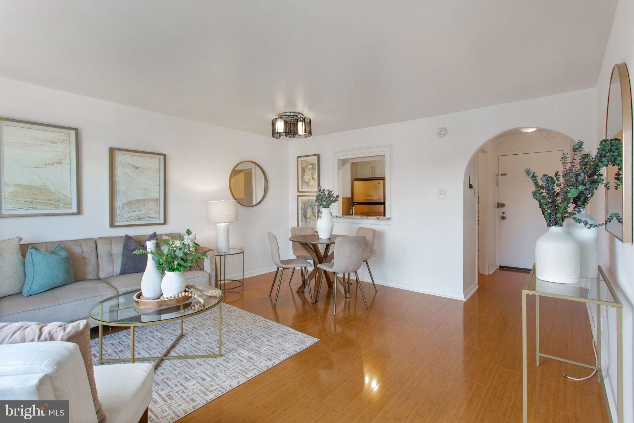 2501 Calvert Street Northwest, Unit 802 Washington, DC 20008 - Photo 9 of 20 a living room with furniture and wooden floor